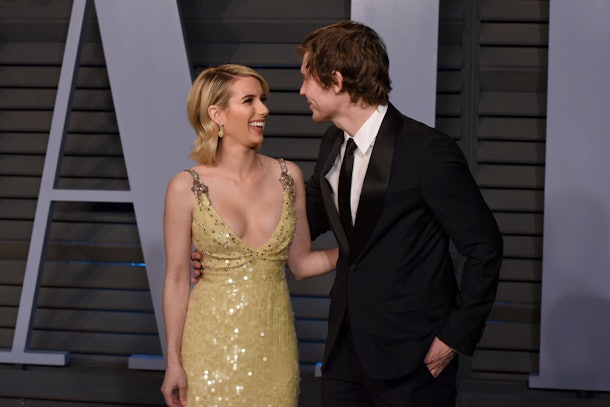 Emma Roberts and Evan Peters attend the Vanity Fair Oscars party.
