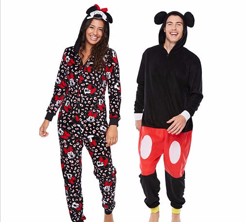 7 matching christmas pajamas for couples that 39 ll keep you onesie christmas pajamas