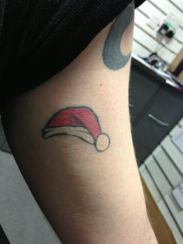 8 Christmas Tattoo Ideas That Are A Little Bit Of Naughty & Nice