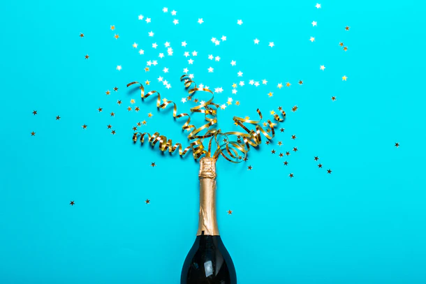 Champagne bottle with colorful party streamers