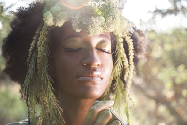 Beautiful woman as a forest goddess with faun headdress. 