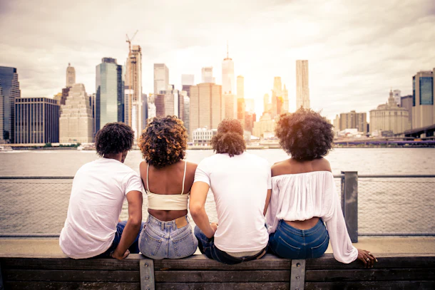Group of afroamerican friends bonding in Manhattan, New York - Young adults having fun outdoors, concepts about lifestyle and young adult generation