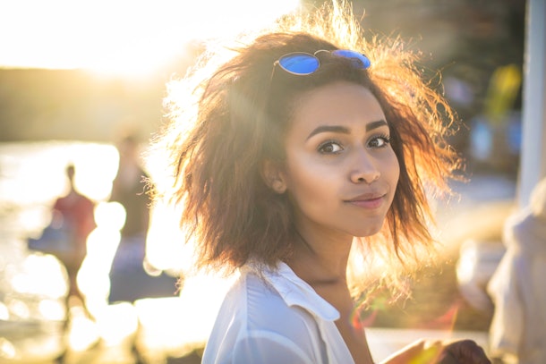 Portrait of a beautiful woman walking in the beach